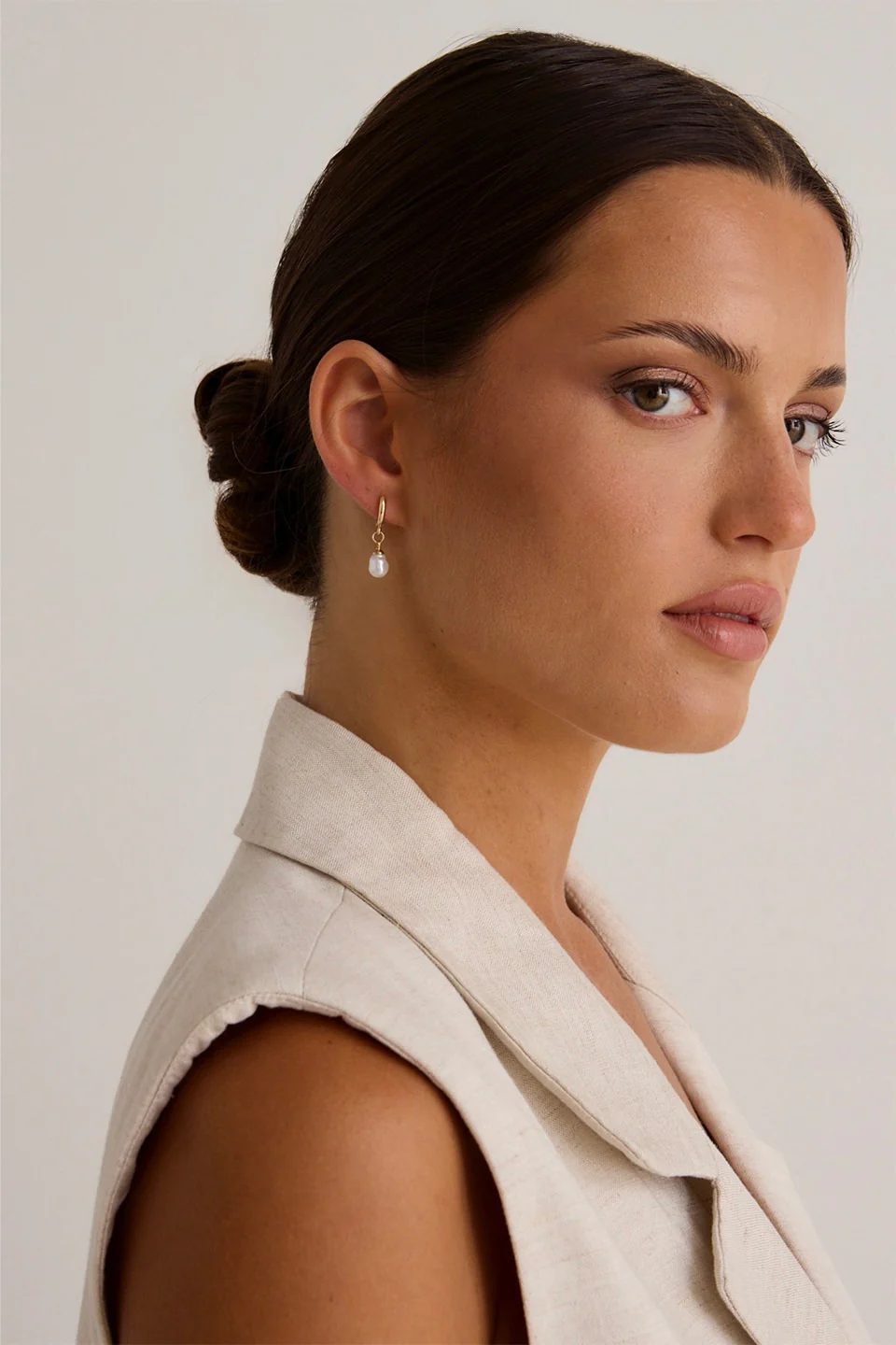 Mini Pearl Huggie Gold Earrings - Image 3