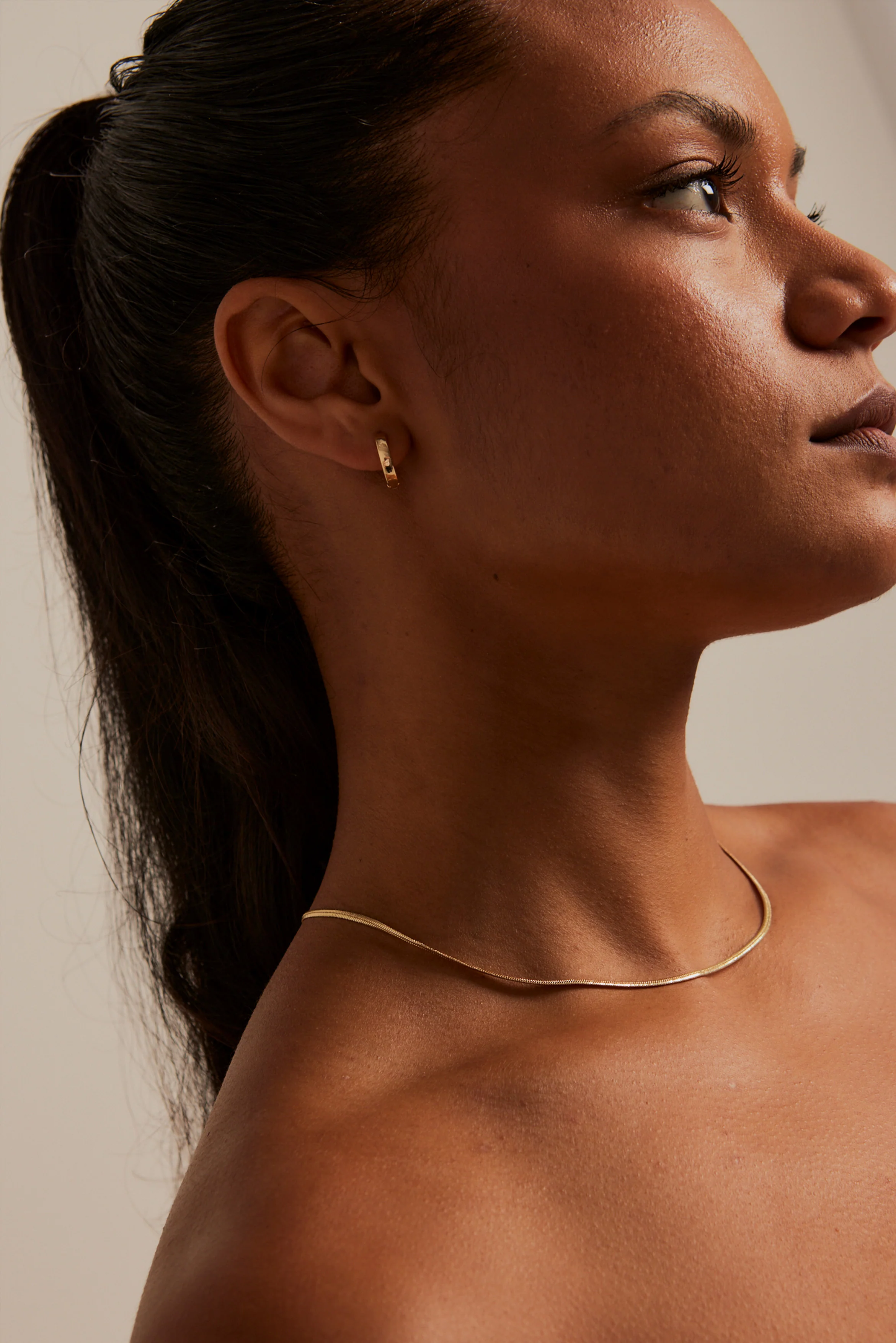 Simple Huggie Gold Earrings - Image 3