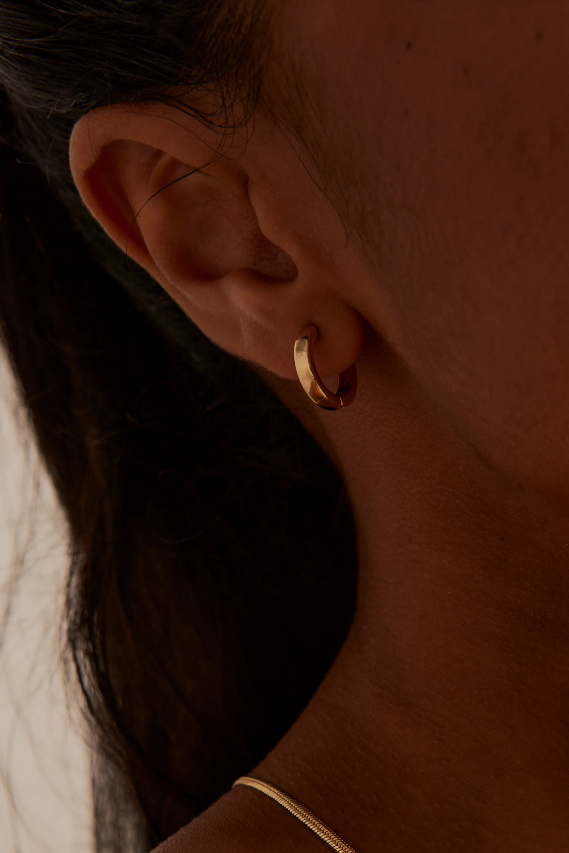 Simple Huggie Gold Earrings - Image 4